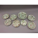 Group of eight various Chinese floral and bird painted plates on green ground One plate has a chip