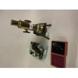 Late 19th or early 20th Century brass and black japanned monocular microscope by Swift of London,