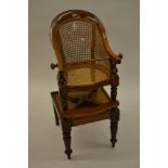 19th Century child's tub shaped high chair with caned back and seat, mounted on detachable stand