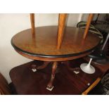 Victorian oval figured walnut tilt-top loo table on turned column and quadruped splay support