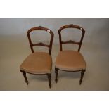 Set of six Victorian walnut drawing room chairs, the carved backs with centre rails above