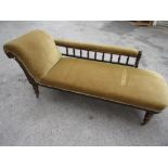 Late 19th or early 20th Century stained beechwood chaise longue, the scroll end and spindle back