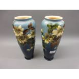 Pair of Leeds pottery vases with painted and relief worked floral decoration in shades of cream,