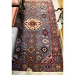 Mid to late 20th Century Belouch rug with a medallion and all-over stylised flower head design on