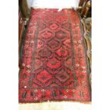 Small mid 20th Century Belouch rug with an all-over stylised geometric design and borders in