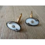 Pair of Russian late 19th / early 20th Century oval 14ct cufflinks in white translucent enamel
