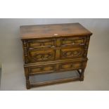Good quality reproduction oak chest, the moulded top above three drawers decorated with geometric