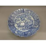 Late 19th or early 20th Century Japanese Imari blue and white charger with a scallopped edge, the