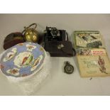 Brass cased military compass, Zeiss Icon bellows camera in a leather case, ten albums of trade cards