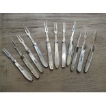 Collection of eleven various 19th Century silver and mother of pearl handled folding forks