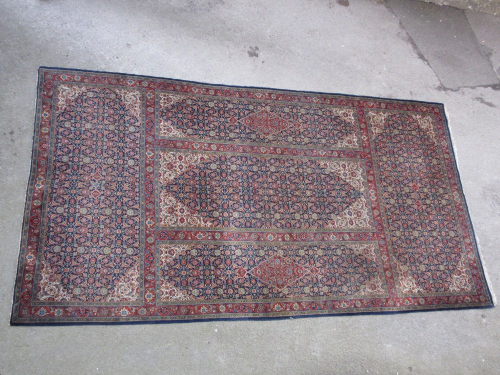 Large Tabriz carpet of unusual five panel Herati and medallion design on a midnight blue ground with