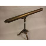 Early 20th Century brass sighting scope mounted on an iron tripod stand Does not look original to