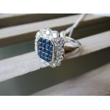 18ct White gold ring set multiple sapphires surrounded by brilliant cut diamonds