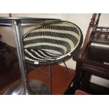 Mid 20th Century black and white satellite chair raised on black metal supports