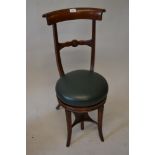 Early 19th Century mahogany rail back adjustable seat music chair raised on splay front supports