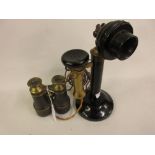 Early 20th Century black painted metal and brass mounted stick telephone, together with a pair of