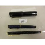 Black Bakelite Giant fountain pen, a Parker Duofold fountain pen and another fountain pen Parker pen
