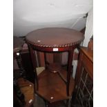 1920's Circular mahogany pie-crust edged two tier occasional table, together with two late Victorian