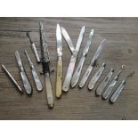 Two silver and steel double bladed knives, four various button hooks, one silver cased tweezer,