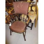 Arts and Crafts mahogany open armchair, the padded ball and baluster bow back above a padded seat