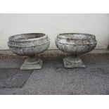 Pair of cast concrete circular pedestal garden urns, 21ins diameter, 19ins high No cracks or chips