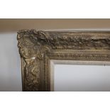 Large gilt moulded composition picture frame, the aperture 34.5ins x 43.5ins, together with six