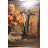 Early 20th Century oil on card, still life with wallflowers in a vase reflected in a mirror,