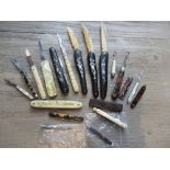 Collection of eleven various small and miniature folding fruit knives, four black lacquer and mother