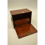 Small 19th Century mahogany table cabinet with gilt brass carrying handles, the hinged fall front