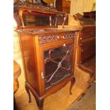 Edwardian mahogany music cabinet with a pierced and mirrored back above single drawer and a glazed