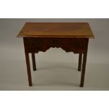 Mahogany lowboy with a moulded top above three drawers, a shaped frieze and square moulded supports
