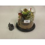 Small 19th Century glass dome enclosing a wax fruit study and a small lead figure of a bird