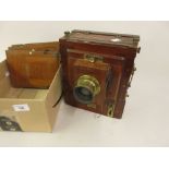 Mahogany and brass plate camera by W. Watson and Sons Ltd., together with three separate plates