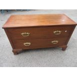 Low oak chest of two drawers with gilt brass handles 40ins wide x 24ins high x 17.5ins deep