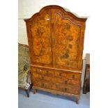 Early to mid 20th Century figured walnut linen press in early 18th Century style, the shaped top