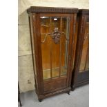 Pair of early 20th Century Continental oak display cabinets, each with a bevelled glass and bar