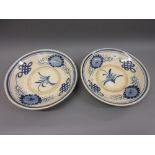 Pair of Studio Pottery dishes of Chinese design decorated in blue and white, 12.25ins diameter
