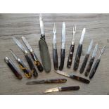 Twelve various 19th Century silver and mother of pearl handled folding fruit knives, together with