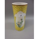 Chinese cylindrical vase with floral painted decoration on yellow ground, 11ins high Some rubbing to