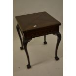 Early 20th Century mahogany envelope card table, the moulded swivel top above a single drawer raised