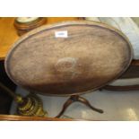 George III oak circular pedestal table with a dish top above a baluster turned column and tripod