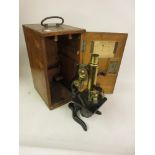 Early 20th Century brass and black japanned microscope in original fitted box