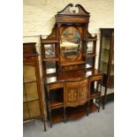 Edwardian rosewood and marquetry inlaid semi bow front chiffonier with an oval mirror inset and