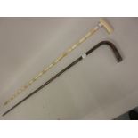 19th Century ivory walking cane together with a silver mounted walking cane