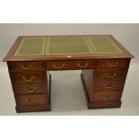 20th Century mahogany twin pedestal desk, the green tooled leather inset top above nine drawers with