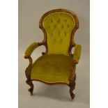 Victorian walnut spoon back elbow chair with gold button upholstered back, upholstered seat and