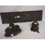 Small carved oak bust of a bishop, an antique carved oak finial and an antique carved frieze panel