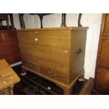19th Century pine mule chest, the hinged lid above two drawers with grained pine decoration