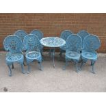 Two sets of four blue painted cast alloy garden chairs, together with a similar circular garden