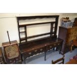 18th Century oak dresser with a shelf back above two frieze drawers with brass swan neck handles